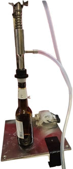 Fermtech Automatic Bottle Fller. For bottling wine, beer, kimbucha, juices, etc. Fill 5 Bottles per Minute. Stainless Steel Design Made in Canada Foods Safe Tubing.