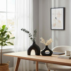 Carrot's Den Black Ceramic Modern Vase Set of 2, Donut Shelf Decor, Black | Pair for bookshelf and bookcase decor, mantel styling, or home staging. Holds dried stems and faux plants indoor.