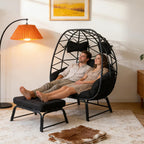 Double Wicker Egg Chair with Ottoman, Indoor Outdoor Egg Basket Lounge Chair with Thick Cushion, 650 lbs Capacity Oversized Rattan Egg Shaped Chair with Leg for Patio Balcony Garden (Black)
