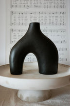 Carrot's Den Black Ceramic Modern Vase Set of 2, Donut Shelf Decor, Black | Pair for bookshelf and bookcase decor, mantel styling, or home staging. Holds dried stems and faux plants indoor.
