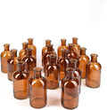 Serene Spaces Living Bud Vases, Apothecary Jars, Decorative Glass Bottles, Centerpiece for Wedding Reception, Mini Flower Vases, Small Medicine Bottles for Home Decor (Amber, Set of 24)