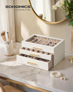 SONGMICS 3-Layer Jewelry Box with Glass Window, Jewelry Storage Organizer with 3 Drawers, Golden Handles, for Rings, Earrings, Bracelets, Gift Idea, Cream White, 6.3 x 9.4 x 4.9 Inches UJBC206WD02S