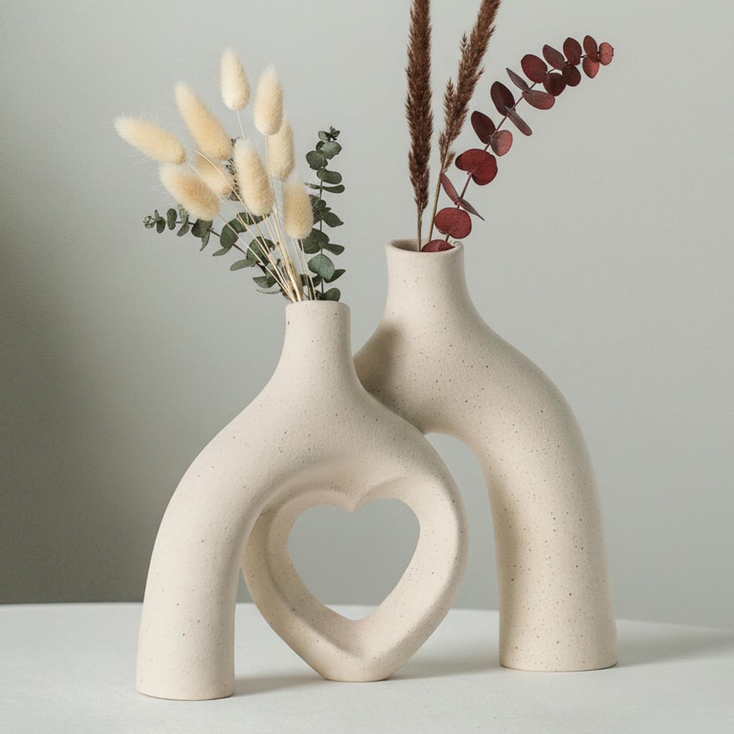 Liotww Snuggle Hollow Hug Donut Ceramic Vase, 8.3 Inch Modern Nordic Boho Style Aesthetic Decorative Flower Vases for Home Decor Pottery Barn Dining Living Room Table Shelf (Milky White)