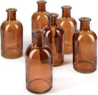 Serene Spaces Living Bud Vases, Apothecary Jars, Decorative Glass Bottles, Centerpiece for Wedding Reception, Mini Flower Vases, Small Medicine Bottles for Home Decor (Amber, Set of 24)
