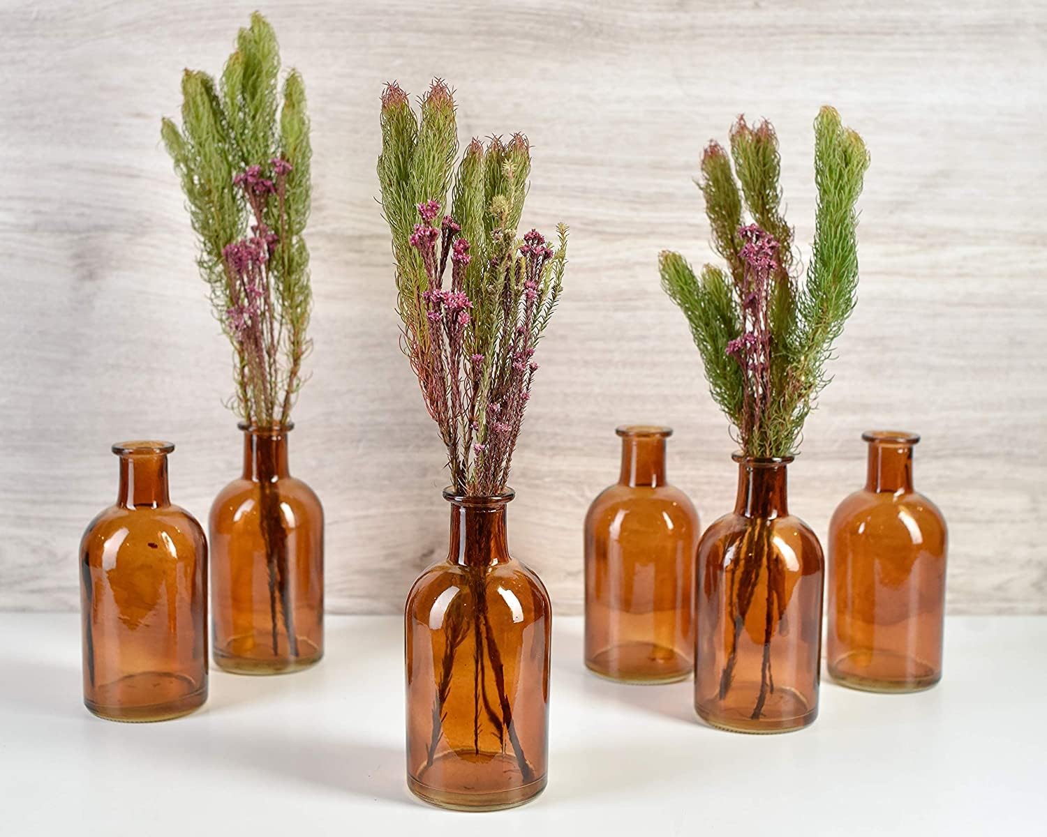 Serene Spaces Living Bud Vases, Apothecary Jars, Decorative Glass Bottles, Centerpiece for Wedding Reception, Mini Flower Vases, Small Medicine Bottles for Home Decor (Amber, Set of 24)