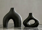 Carrot's Den Black Ceramic Modern Vase Set of 2, Donut Shelf Decor, Black | Pair for bookshelf and bookcase decor, mantel styling, or home staging. Holds dried stems and faux plants indoor.