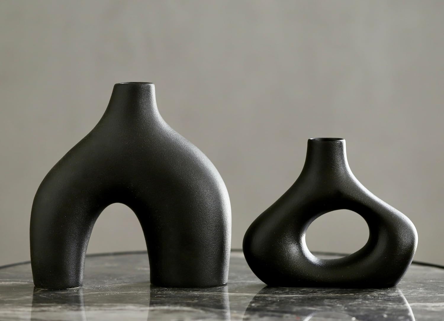 Carrot's Den Black Ceramic Modern Vase Set of 2, Donut Shelf Decor, Black | Pair for bookshelf and bookcase decor, mantel styling, or home staging. Holds dried stems and faux plants indoor.