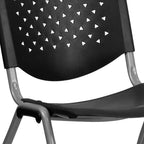 EMMA + OLIVER Home and Office Black Plastic Stack Chair with Perforated Back - Guest Chair