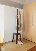 Umbra Pillar Coat Rack with Stool, Freestanding 6 Hooks, Black/Walnut | Rubberwood and metal construction, space-saving vertical design, no tools assembly, holds bags or plants