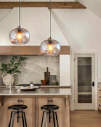 CASAMOTION Hand Blown Clear Glass Pendant Lights with Black Marble, Modern Rustic Kitchen Island Ceiling Hanging Light Fixtures for Dining Room Table Bedroom, Oval Globe 8.7 Inch Diameter, 2 Pack