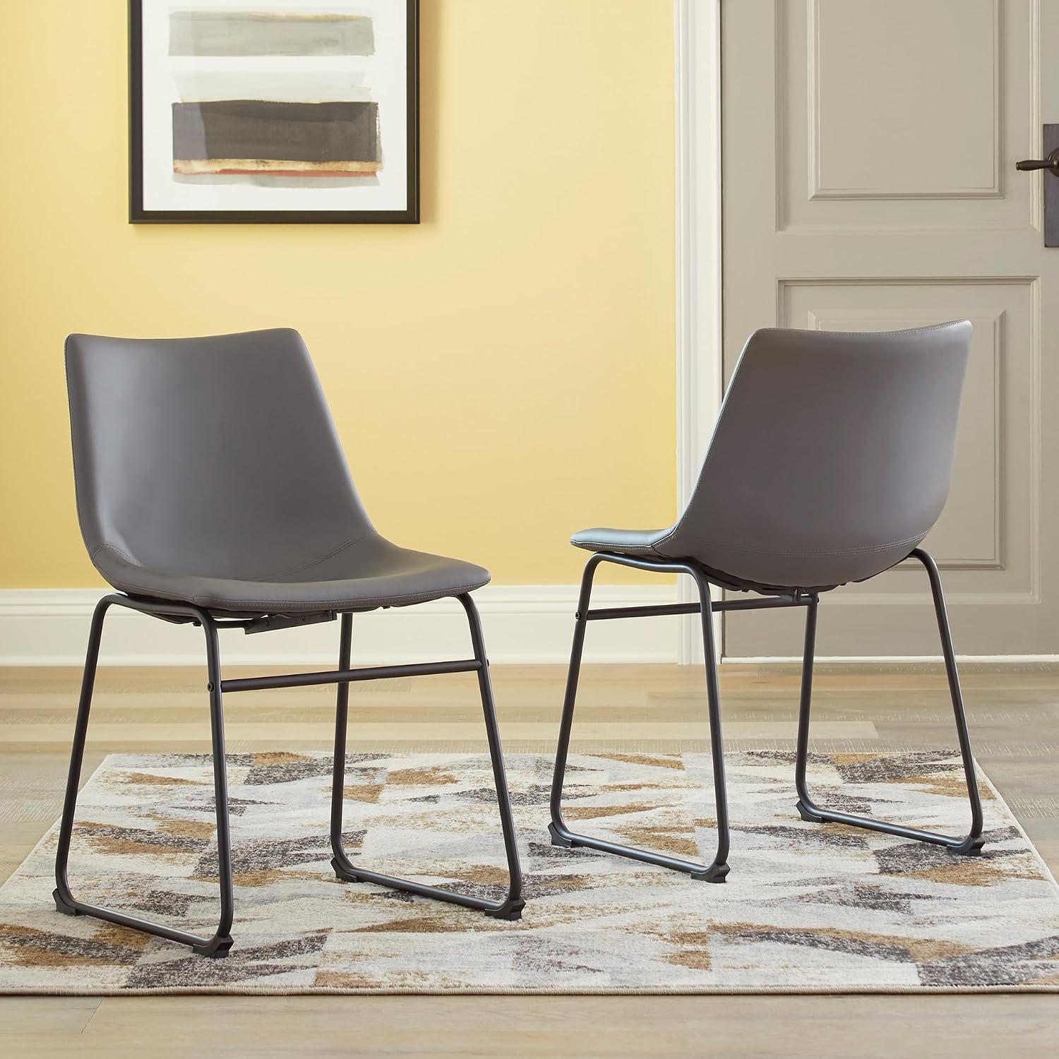 Signature Design by Ashley Centiar Faux Leather Dining Chairs, Set of 2 | Mid century modern bucket seat, Sturdy black metal frame sled base with floor glides, Easy to clean wipeable upholstery