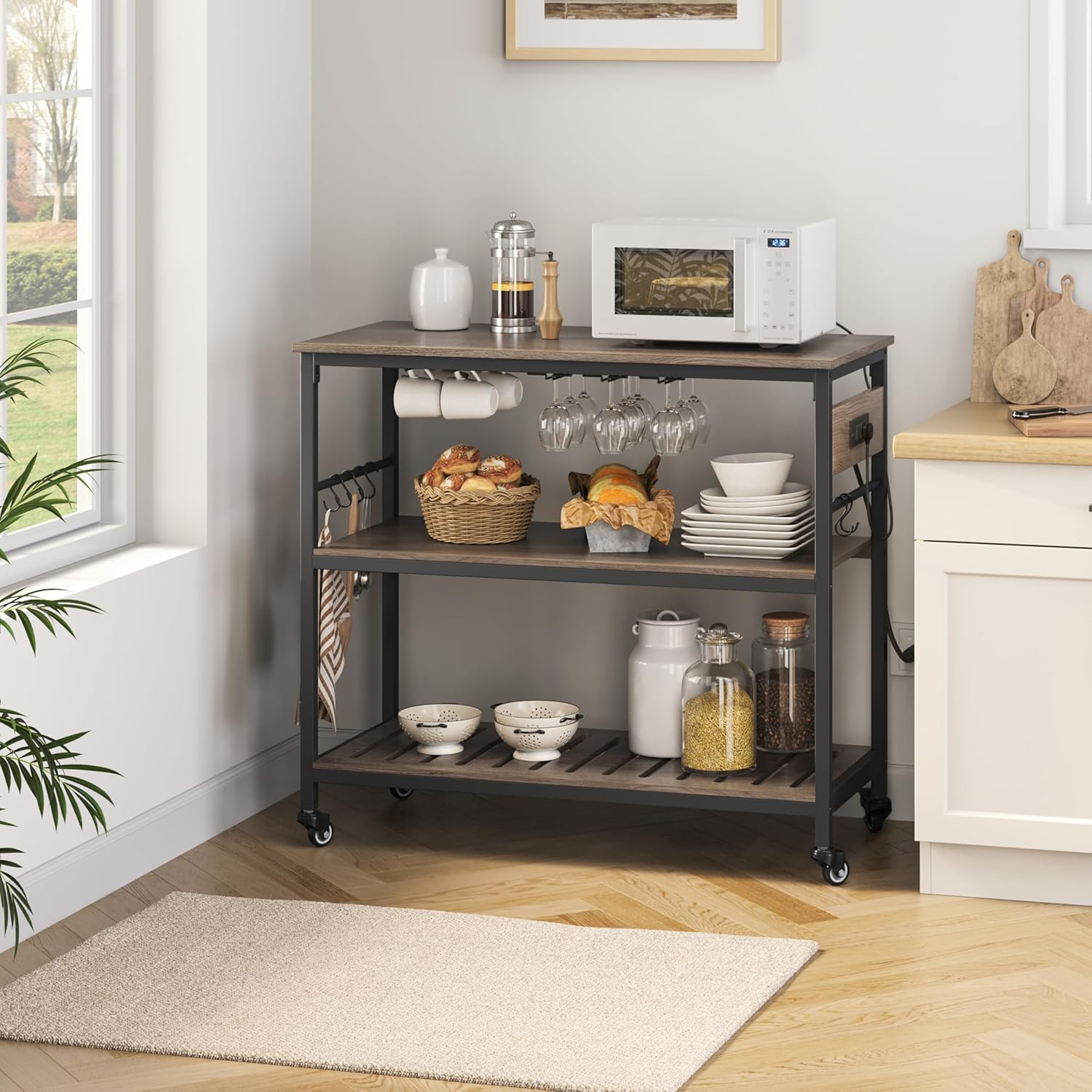 Yaheetech Kitchen Island Cart with Power Outlet, Kitchen Carts on Wheels with Storage, 3-Tier Microwave Stand with Foodpads, Glass and Mug Holders, 8 Hooks, Taupe Wood