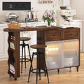 69" Kitchen Island with 360° Rotating Table,LED Lighting, Adjustable Shelves, Storage Cabinet & Power Outlet – Walnut Finish Extendable Dining Table for Kitchen, Dining Room, Bar