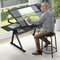 Black Drafting Table Desk w/Stool, Painting Table Art Craft Desk Crafting Table with Tilting Tempered Glass Top, 2 Storage Drawers, Height Adjustable
