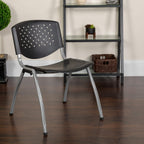 EMMA + OLIVER Home and Office Black Plastic Stack Chair with Perforated Back - Guest Chair