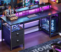 Furologee 51" Gaming Desk with Power Outlets & LED Lights, Reversible Computer Desk with File Cabinet & Monitor Stand for Home Office, Large Work Table with Storage Shelves & Drawer, Black