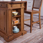 Homestyles Americana Cottage Oak 3-Piece Kitchen Island Set with Hardwood Drop Leaf Top and Two Counter Stools